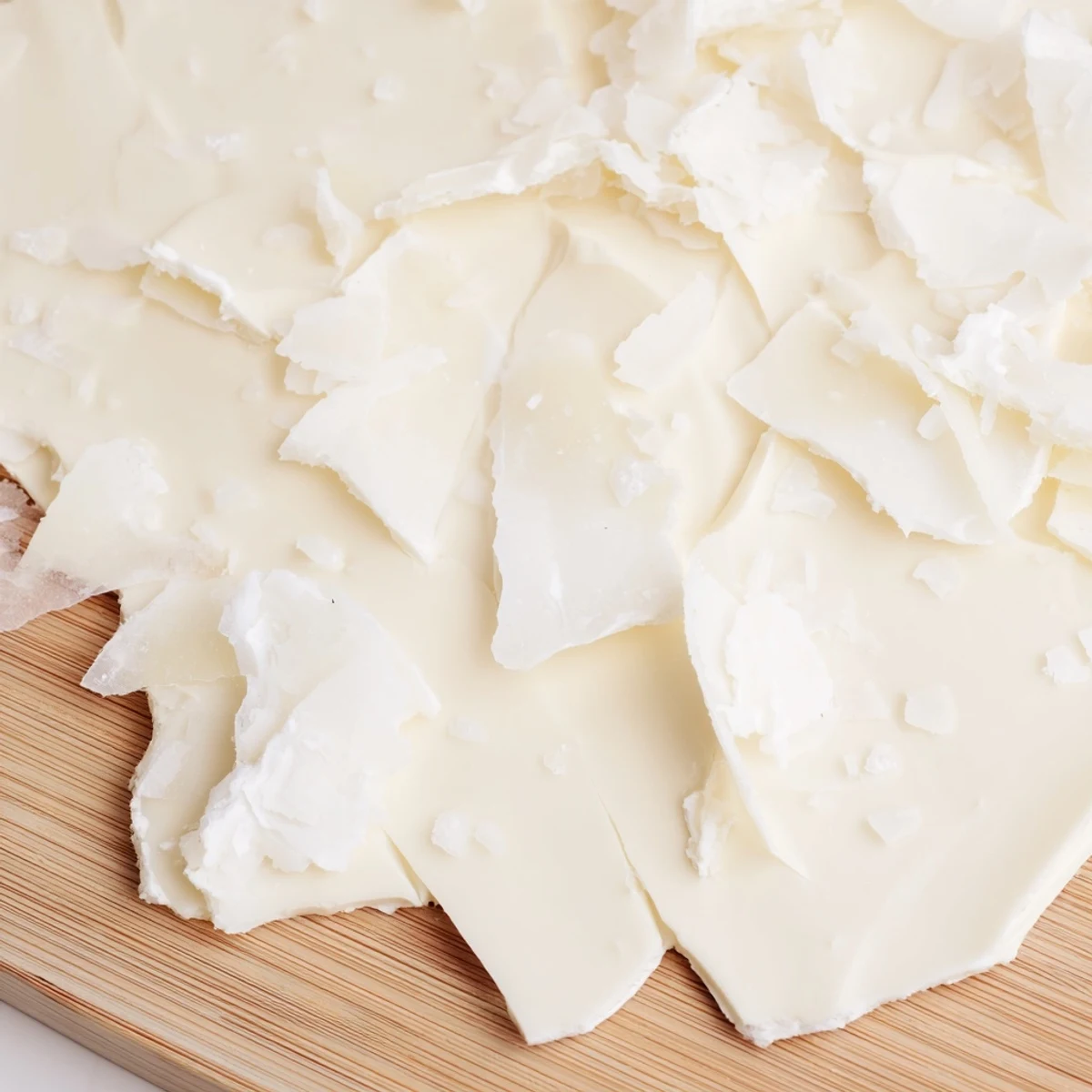 A chilled light wood board shows the dramatic presentation of The Arctic Tundra dessert, stunning.