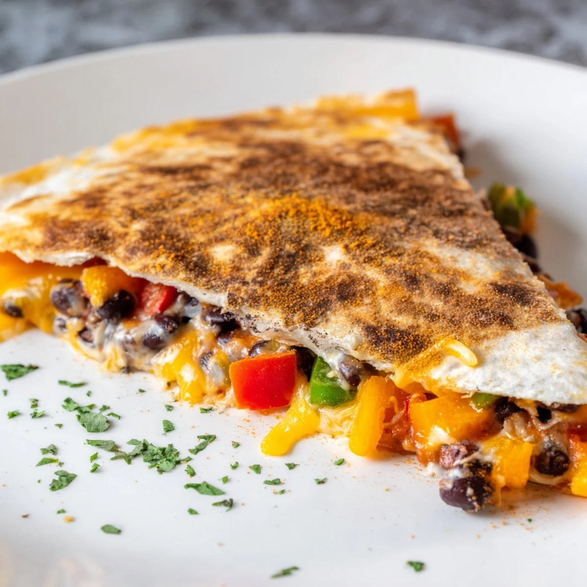 Melting cheese and savory black beans filling a perfectly golden Black Bean Quesadilla.