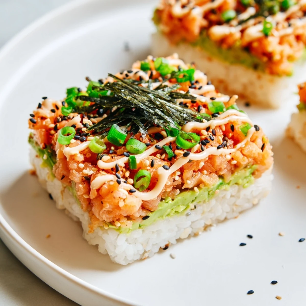 Golden, crispy rice topped with spicy salmon, a beautiful Crispy Rice Salmon Stack.