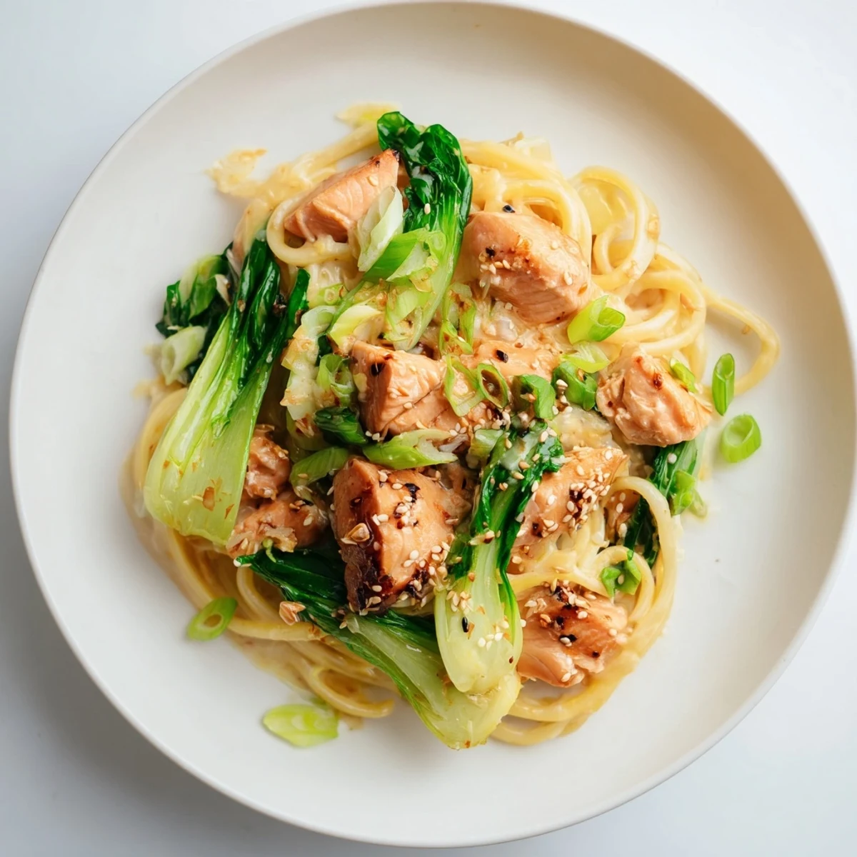 Tender salmon nestled in delicious pasta, all coated in a flavorful miso butter sauce.
