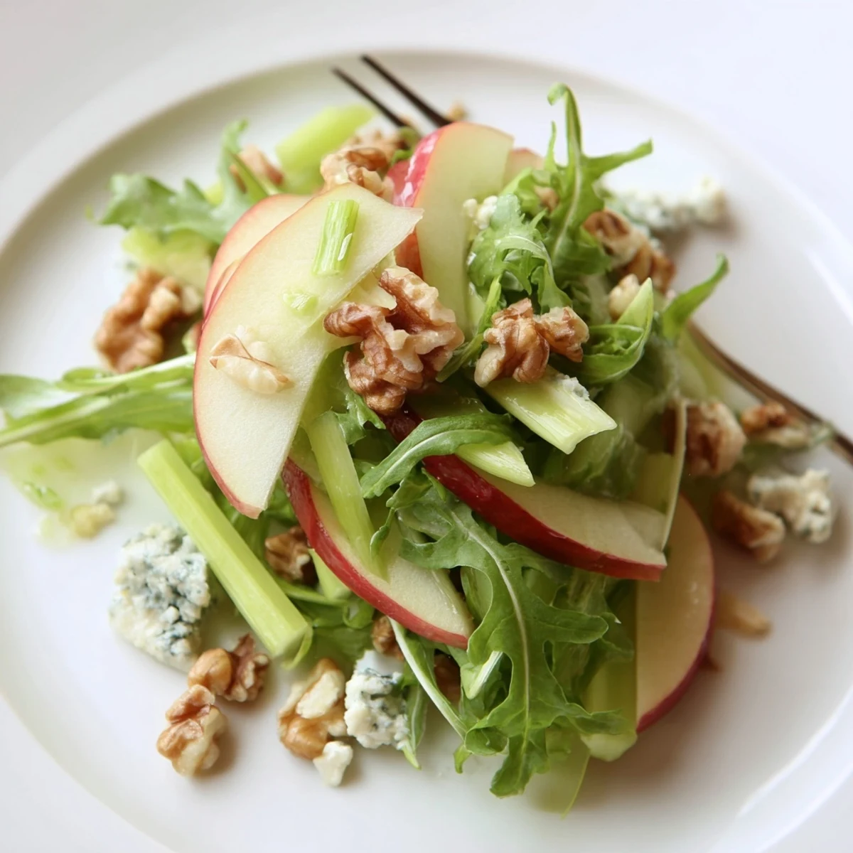 Freshly sliced Honeycrisp apples and toasted walnuts tossed with mixed greens and tangy blue cheese in a light vinaigrette.  