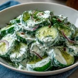Light and creamy cucumber salad with fresh dill, featuring cool cucumbers and a smooth Greek yogurt dressing, perfect for warm weather