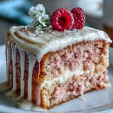 Delicate pink Rosé Velvet Cake with luxurious cream cheese frosting and shimmering gold.