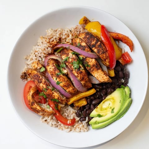Make-Ahead Chicken Fajita Meal Prep Bowls: sizzling chicken and colorful peppers over fluffy rice, ready to eat!