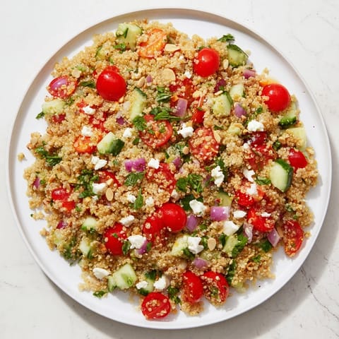 Fluffy Make-Ahead Quinoa Salad, tossed with vibrant vegetables and a bright lemon vinaigrette, ready to serve.