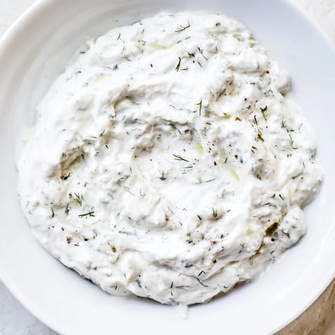 Homemade Greek Yogurt Ranch Dip, pictured alongside colorful veggie sticks for easy snacking and dipping enjoyment.