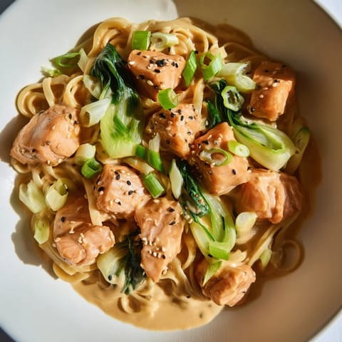 A close-up of Miso Butter Salmon Pasta, showing the rich sauce coating the noodles and salmon.