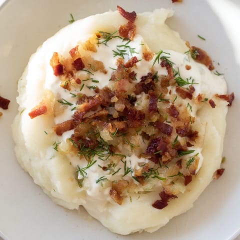 Steaming Lithuanian Cepelinai, fresh from the pot, offer a hearty, comforting potato dumpling meal with toppings.