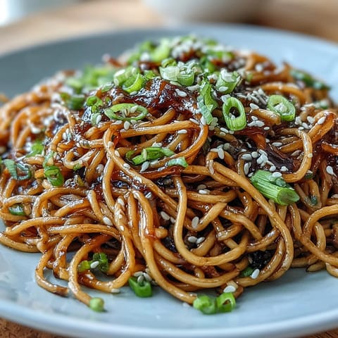 Asian Ginger Scallion Noodles with Soy Glaze, a vibrant noodle dish tossed in a savory-sweet soy glaze with fresh ginger and scallions, perfect for a quick weeknight meal.
