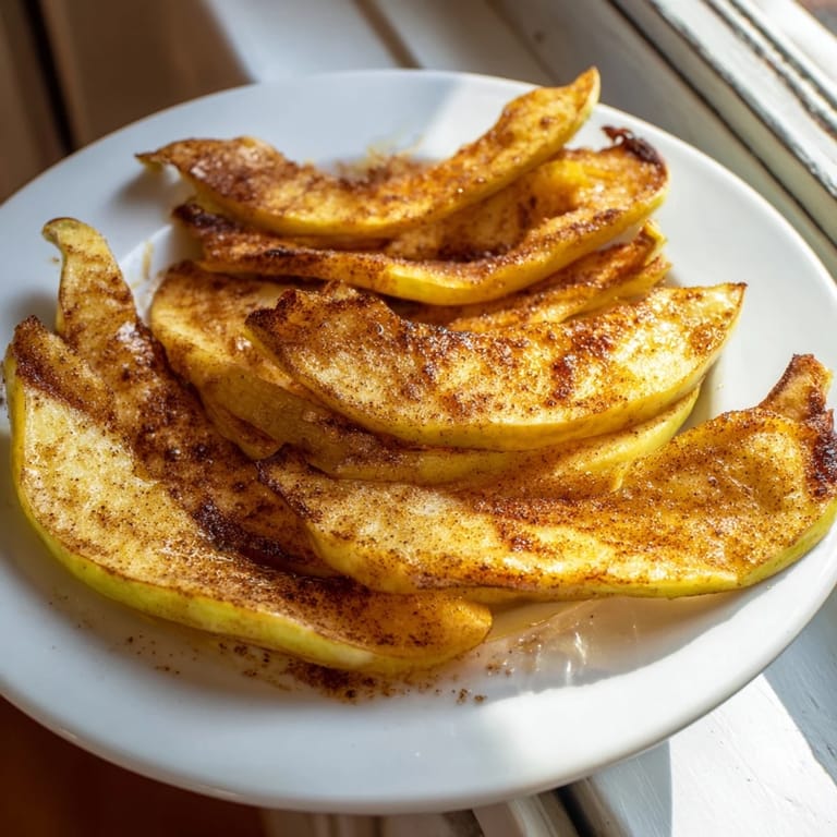 Tender, caramelized Baked Apple Slices, with nutmeg's aroma, a cozy dessert for any occasion.