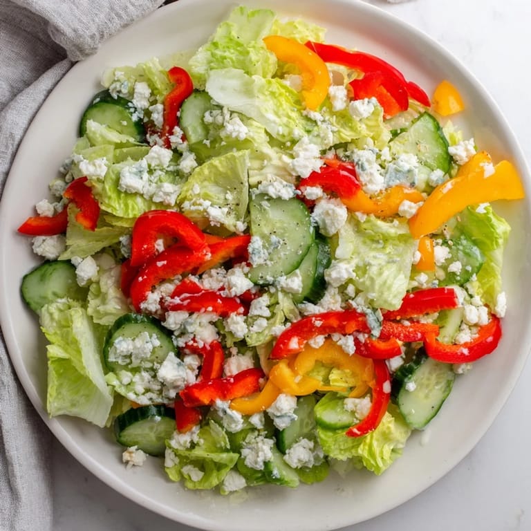 This Bella Hadid Salad features vibrant red peppers, cucumber, and feta, ready to be enjoyed.